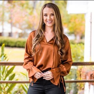 Caramel ruffle wrist and neckline long sleeve blouse
